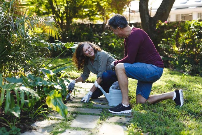 Happy senior couple gardening together