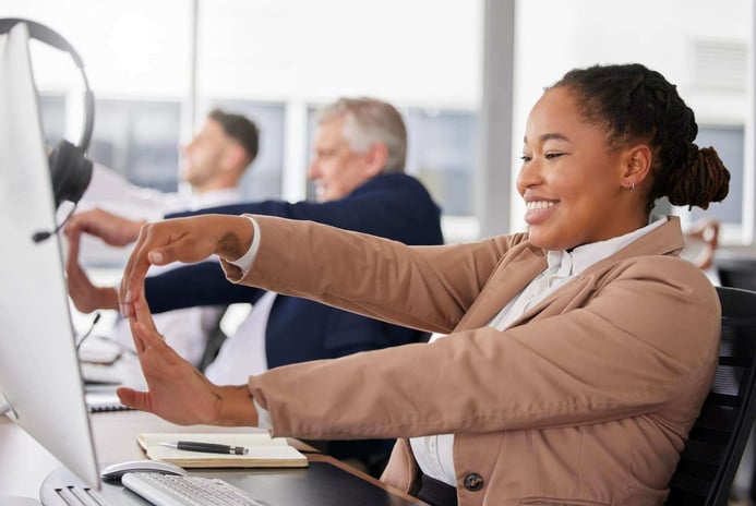 Woman call center and stretching hand at desk