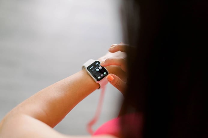 Woman checking notifications on her apple watch