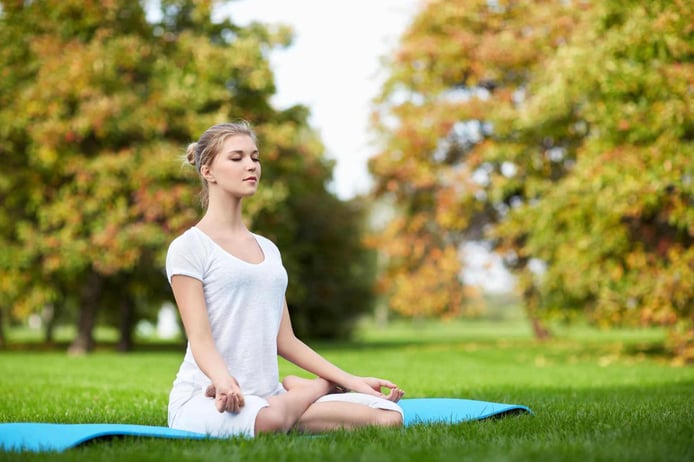 Young girl practicing yoga