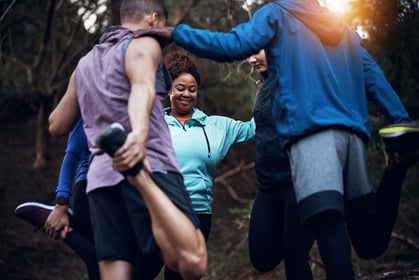 group of people stretching outdoors