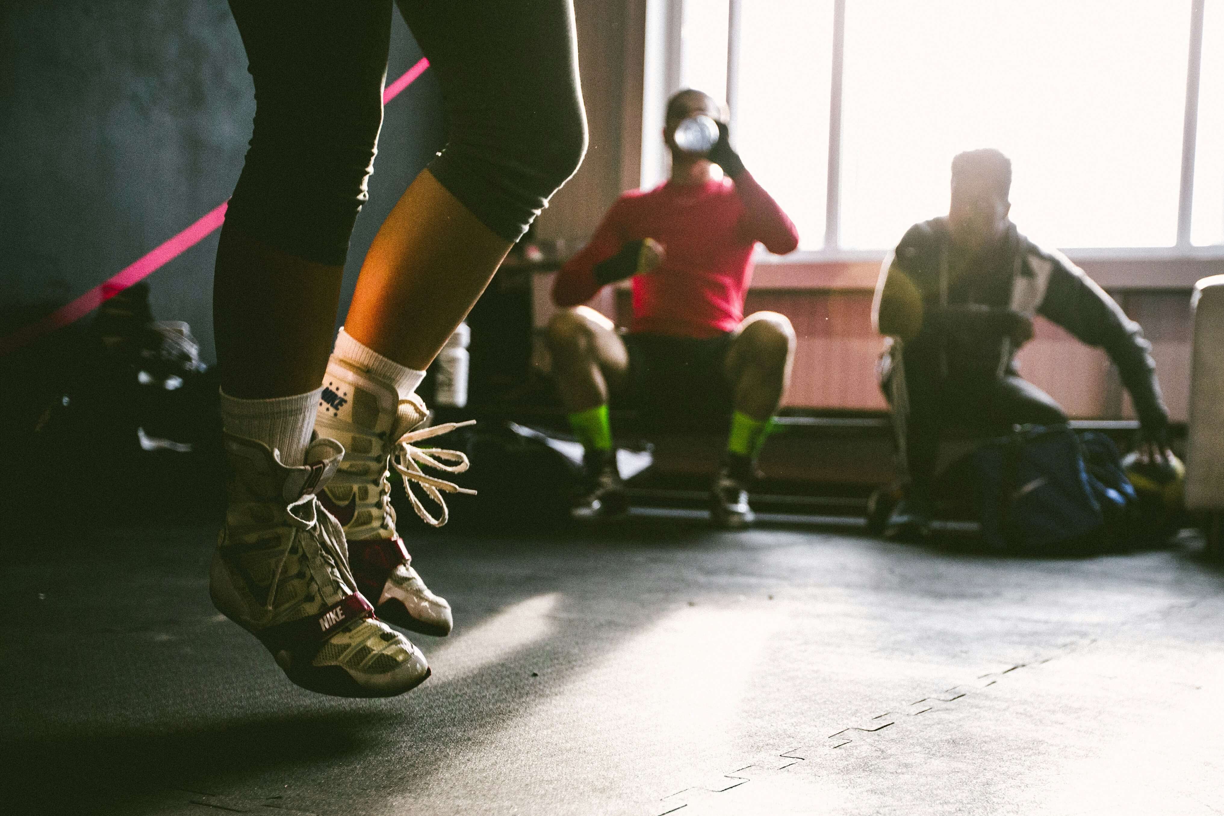 A few people together exercising in a gym