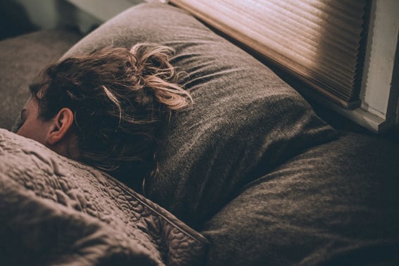 A woman asleep in a bed