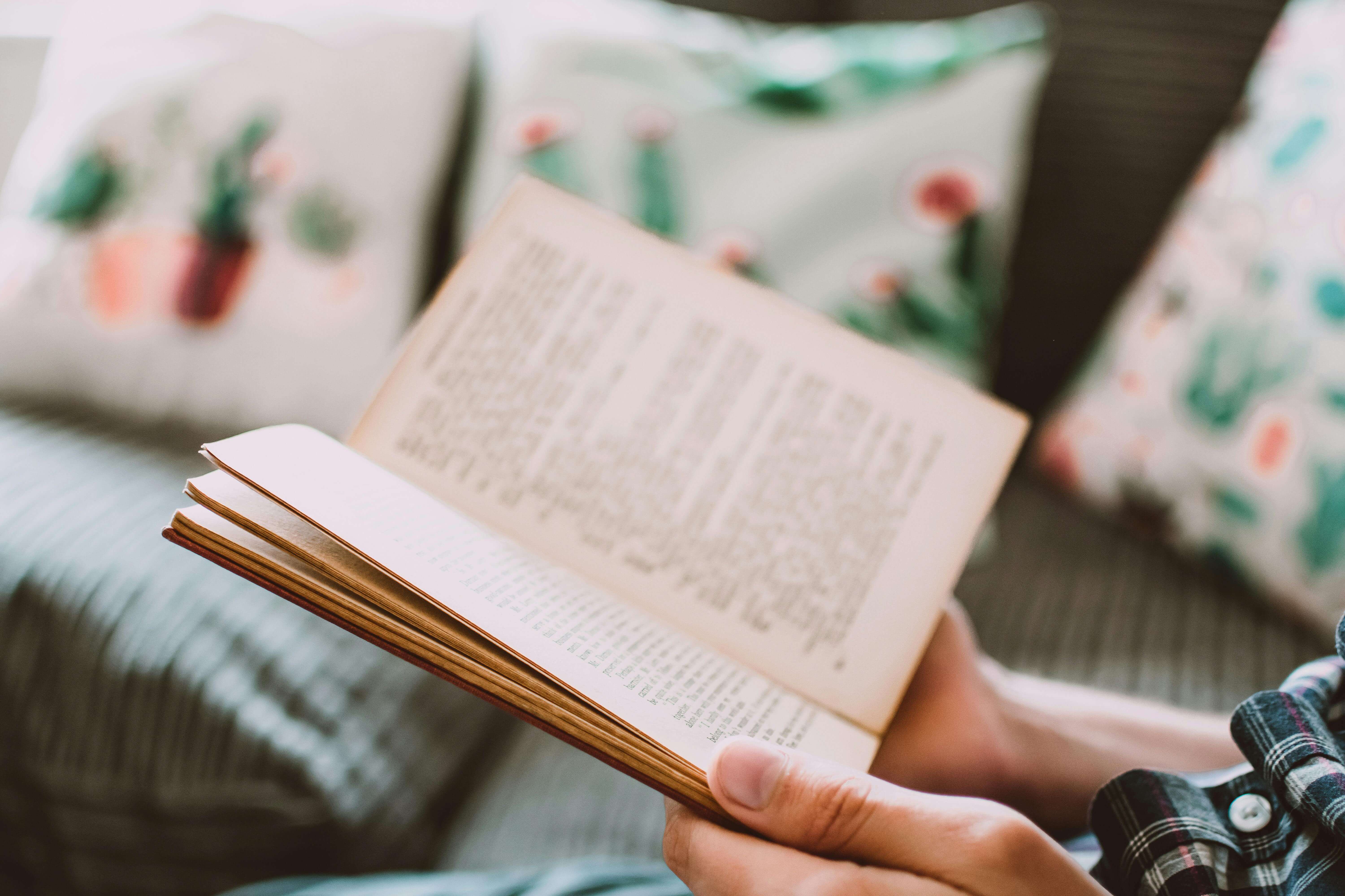 A person reading an open book