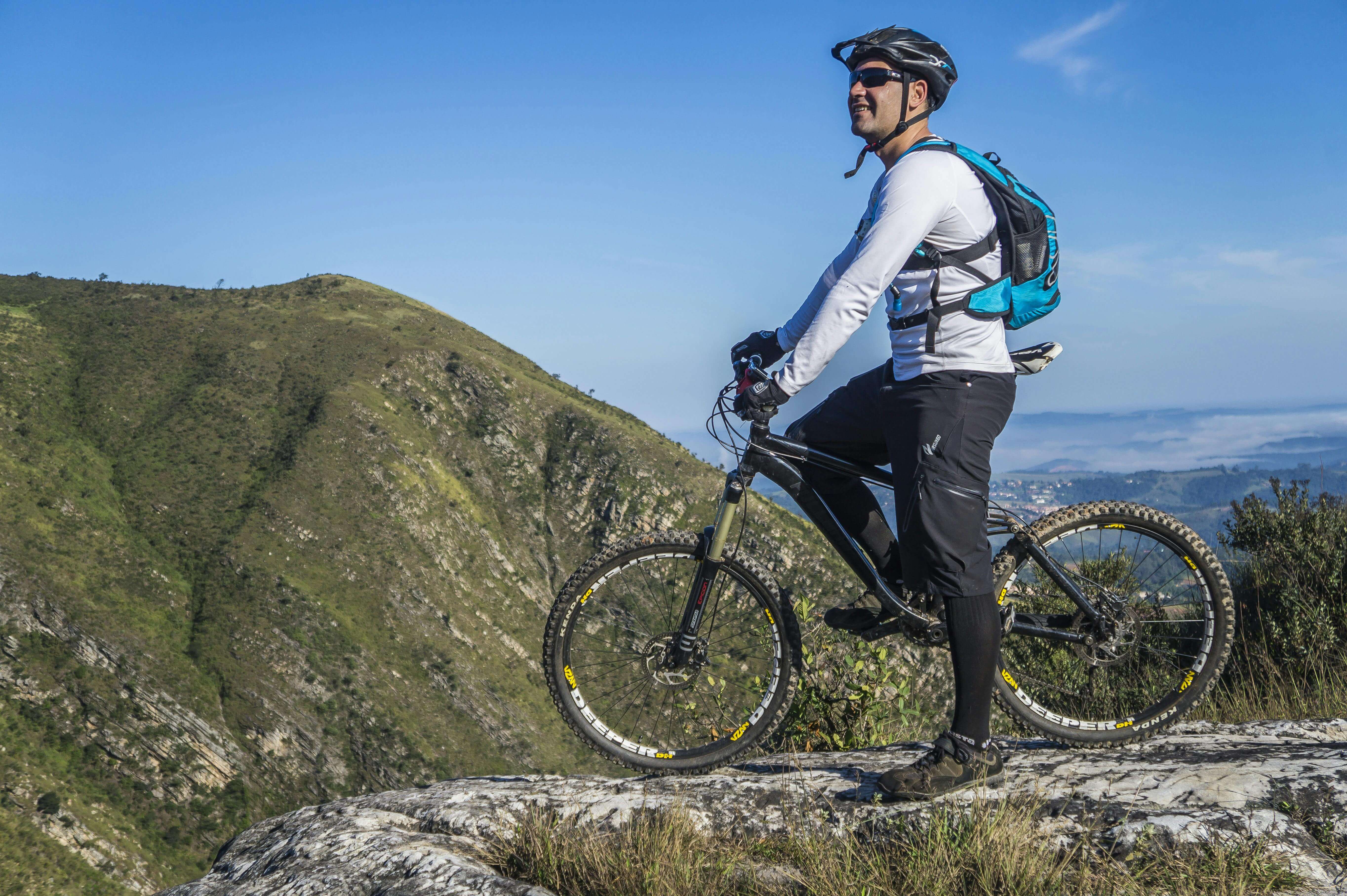 A man on a bike at the top of a hill