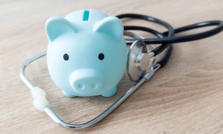 stethoscope and a piggy bank
